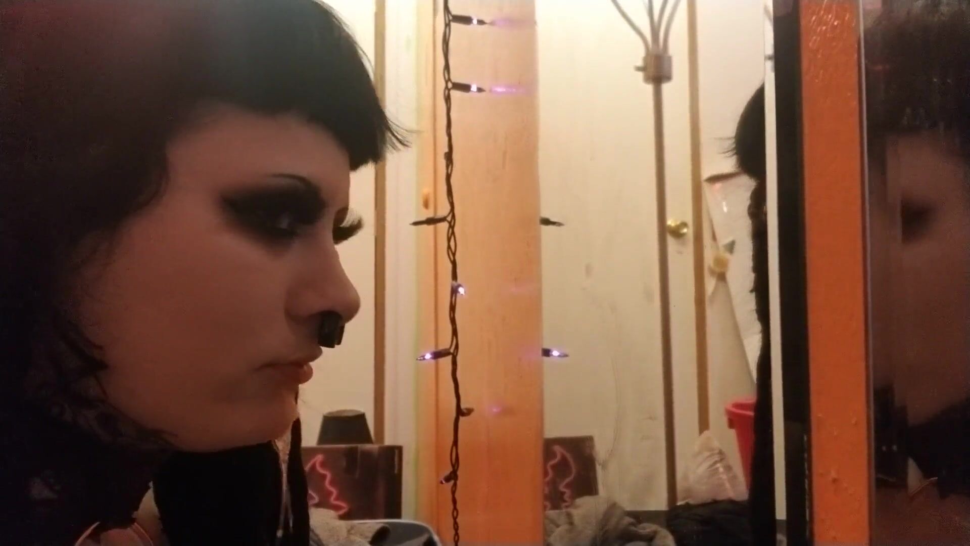 Sexy Goth girl sloppily sucking a small-sized Dildo