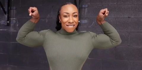 Humongous black female ebony muscle Sheena Wash bursting through shirt