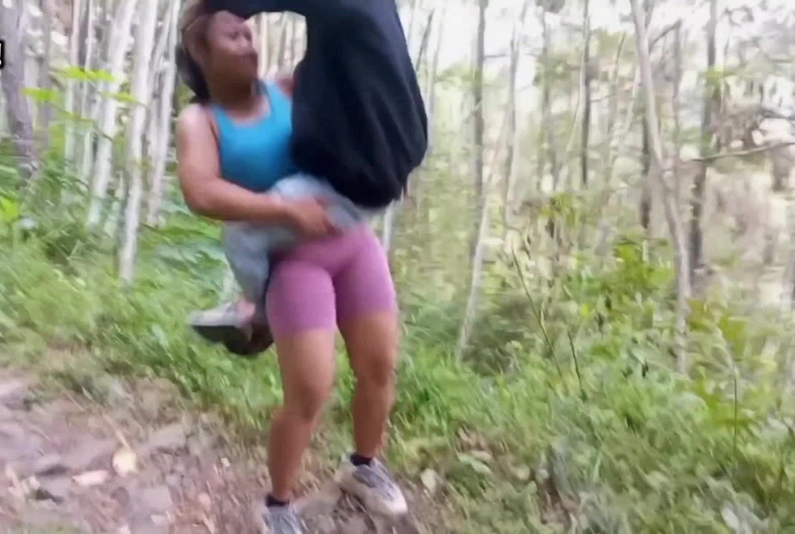 Woman Hip carry man in forest