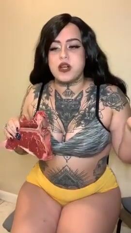 Woman eating raw meat with burps