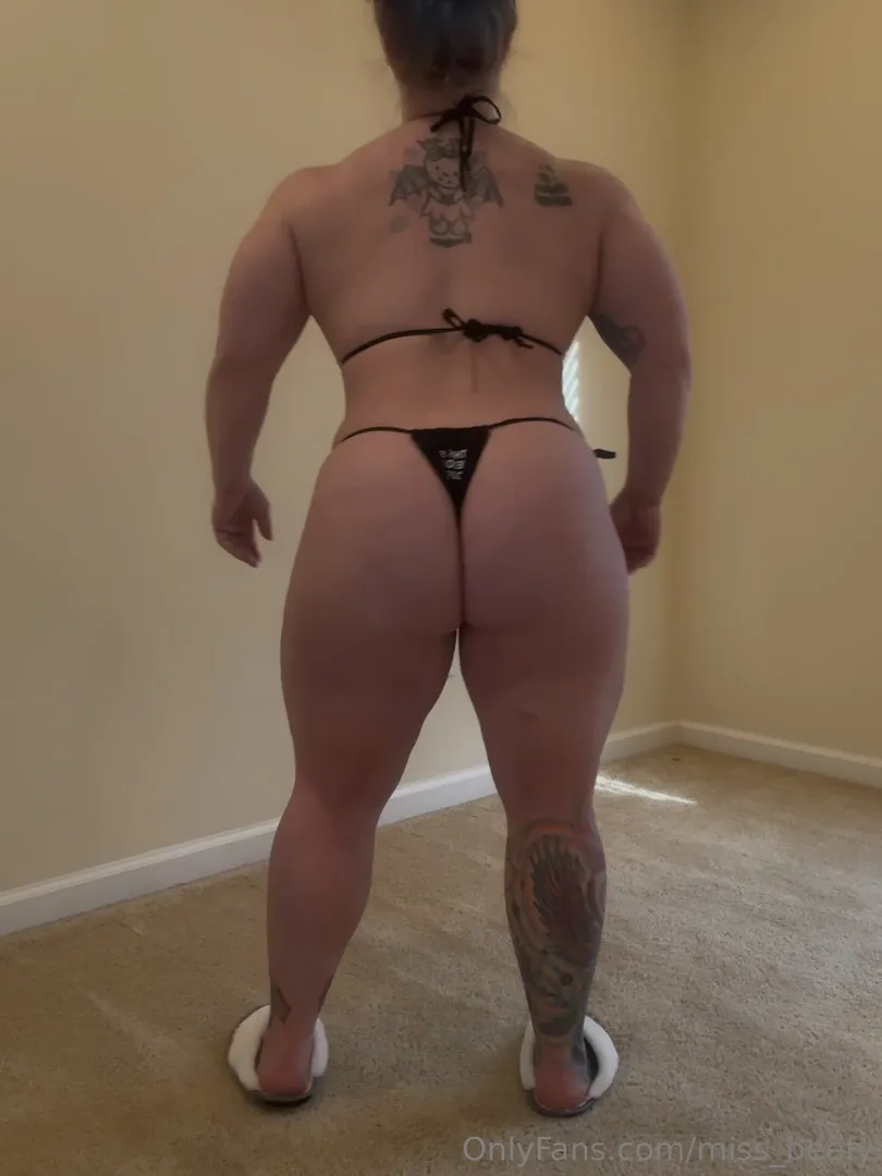 missbeefy flexing muscles in tiny bikini