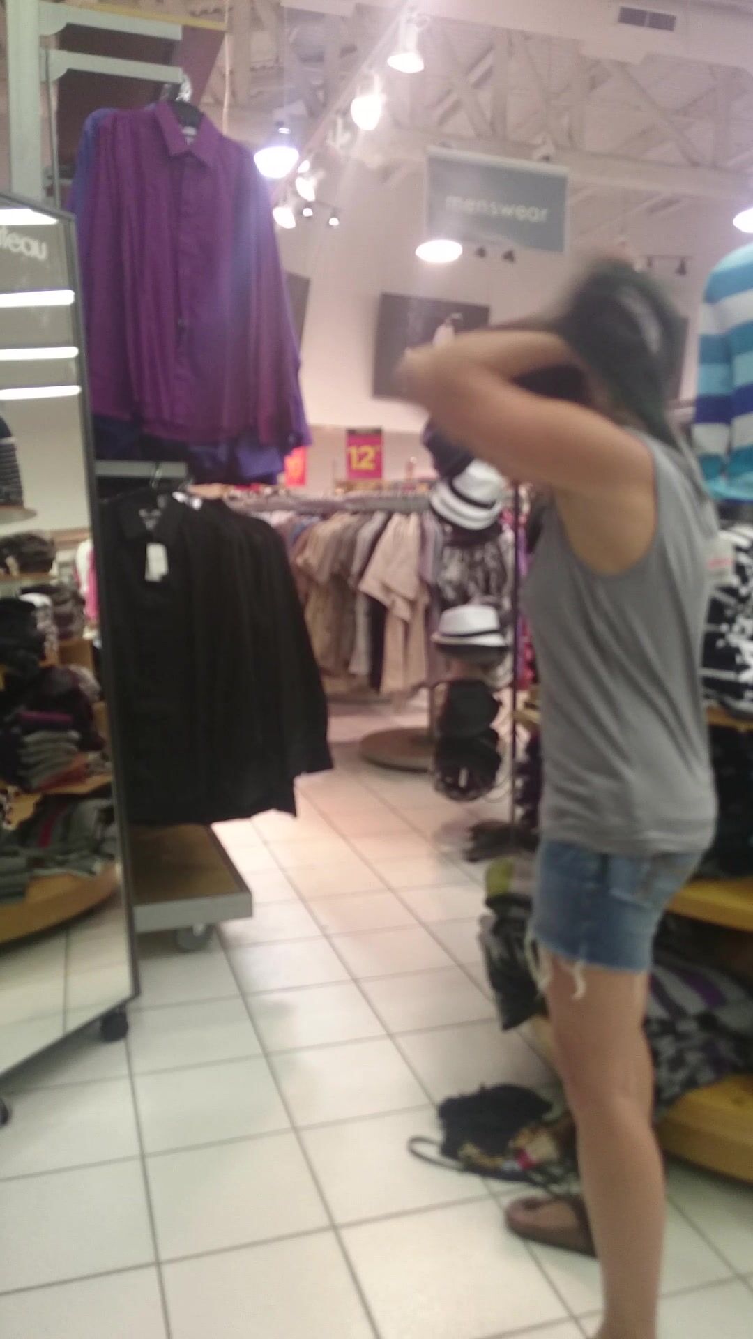 girl strip in cltohes store