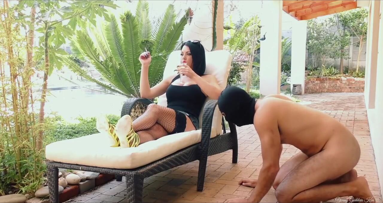 young goddess kim outdoors with slave