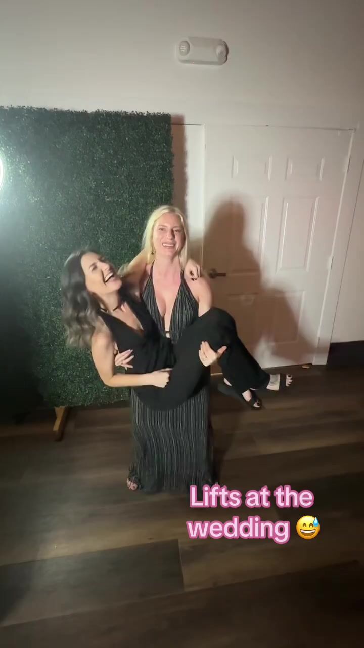 Cradle carry squat on lesbian wedding