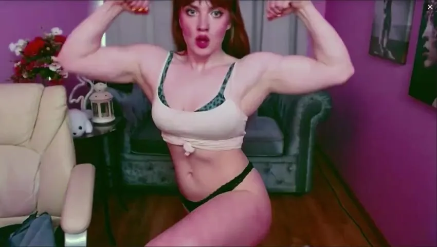 Redhead Muscle Girl Flexing