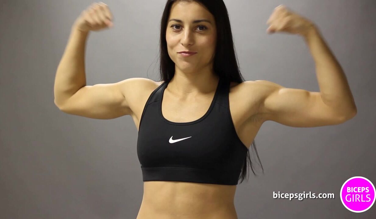 Martina flexing huge biceps