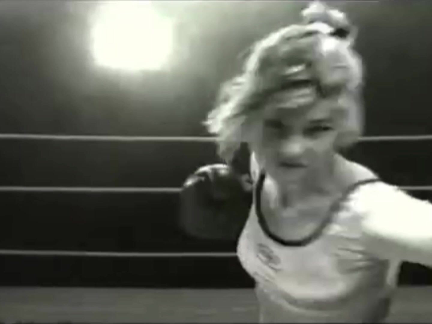 Female Beating Man on the ropes