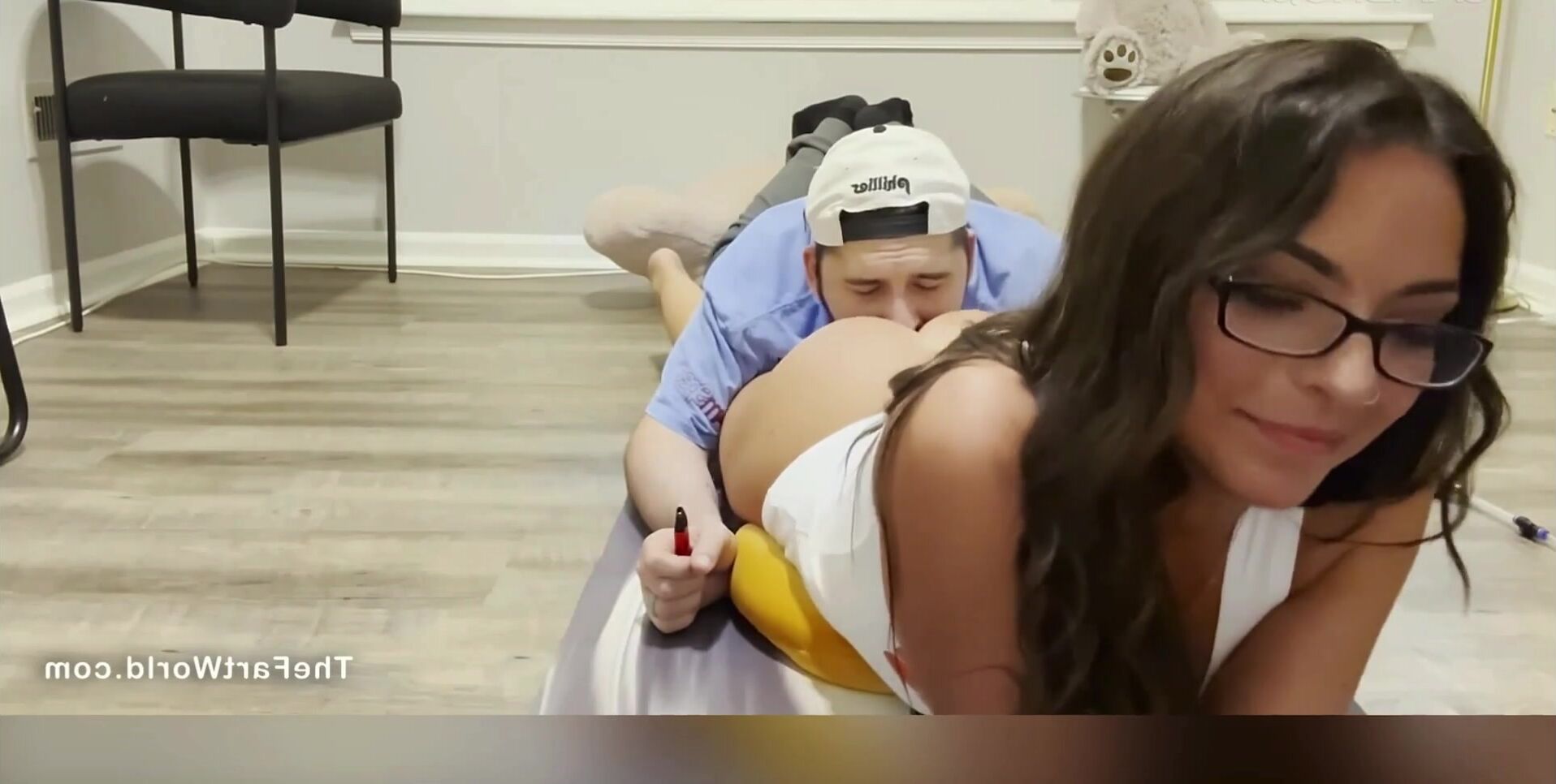 Lady relaxes by farting on man's face