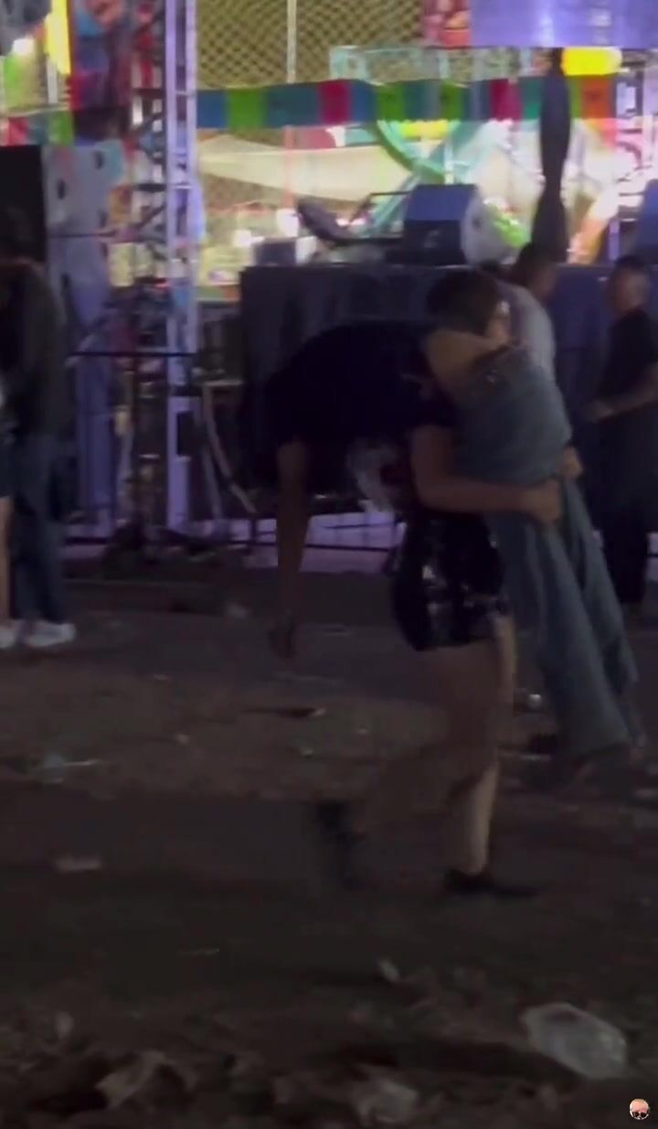 Tipsy dude carried by sexy girl