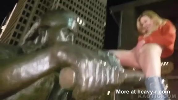 She urinates on a statue in the square