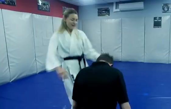 karate girls kicking a guy