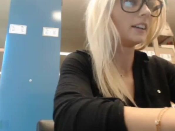 Cute blonde college girl flashing in the library