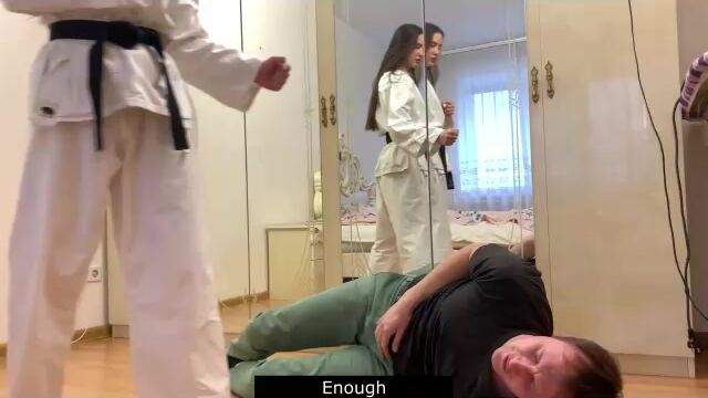Karate girl in gi teaches a lesson