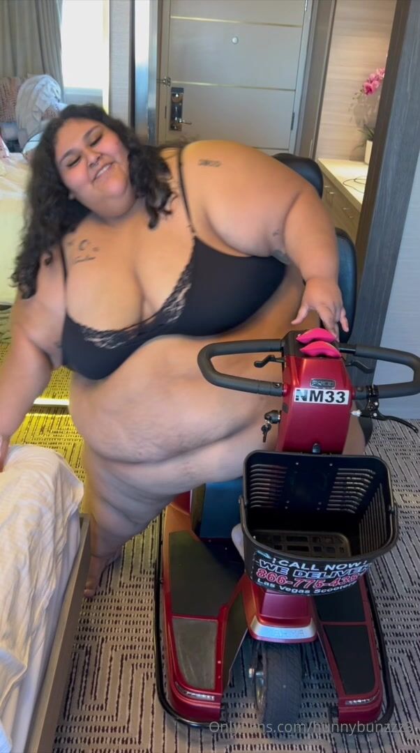 Hunny Bunzz getting on the scooter