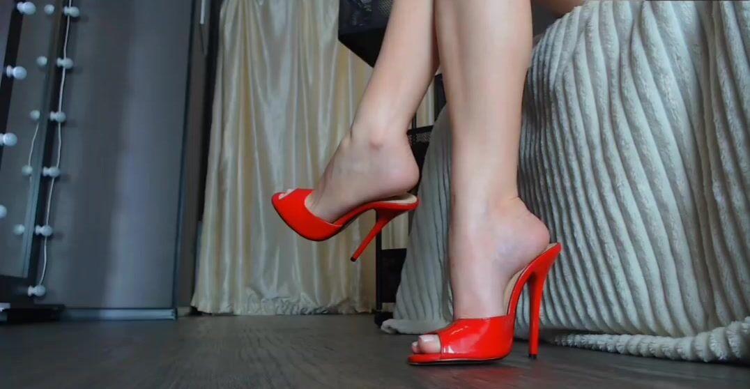 Sexy legs and feet blonde teasing In High Heels