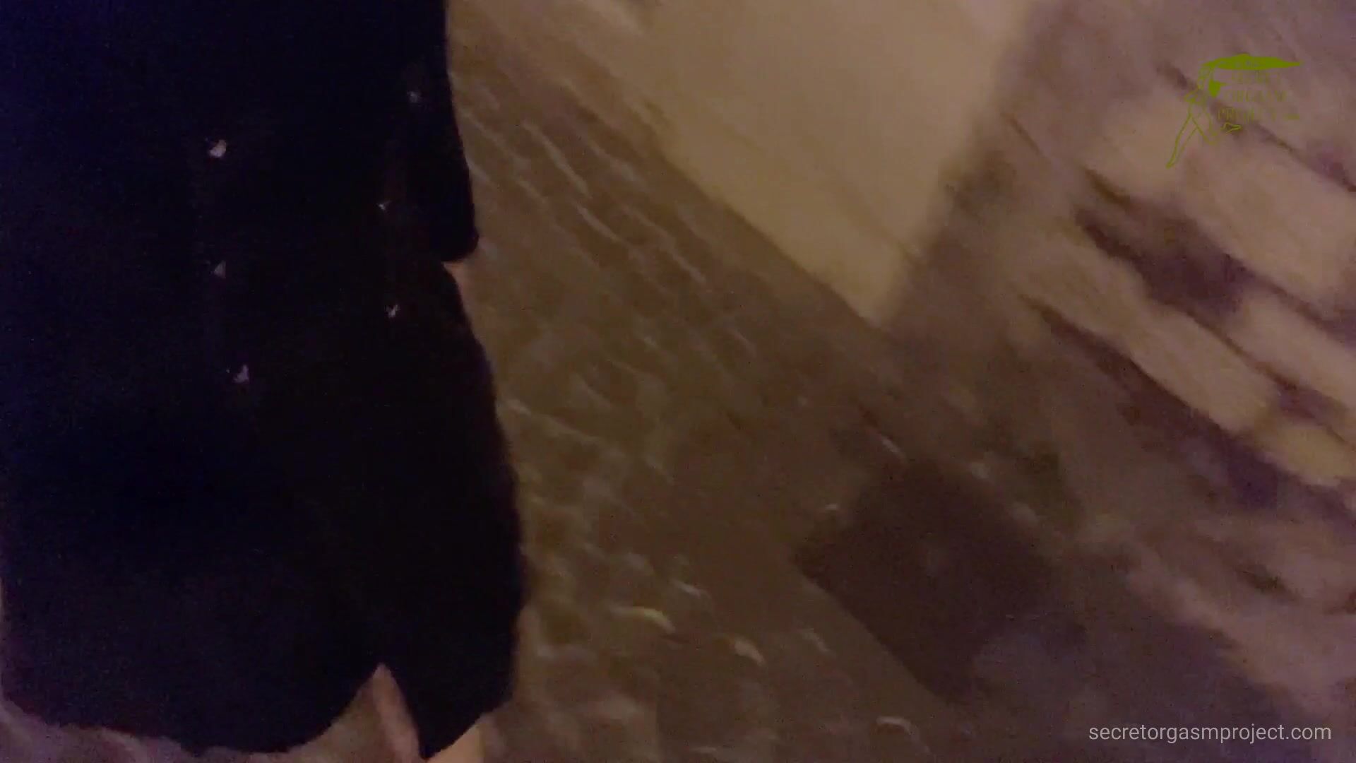 Cece flashing in town at night
