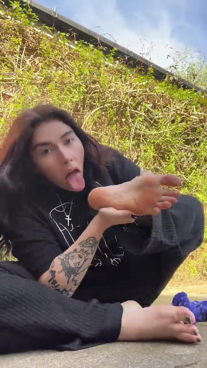 beautiful girl sucking her own toes