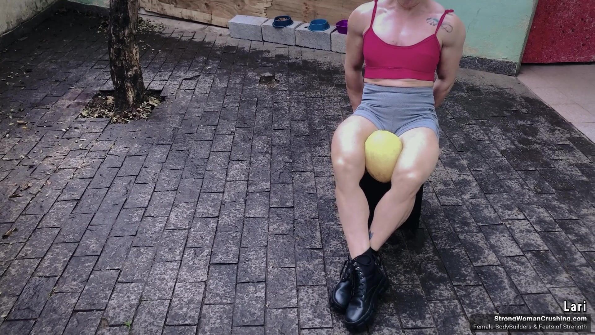 Lari destroys a melon with her huge muscles