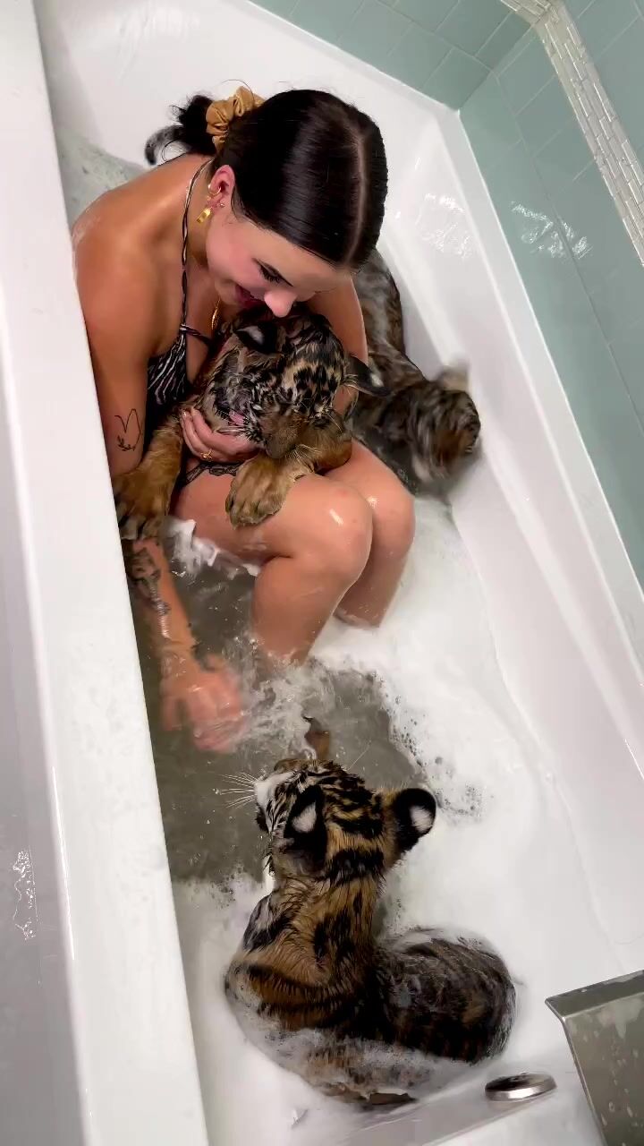 Sexy girl - Bathing with tiger cubs