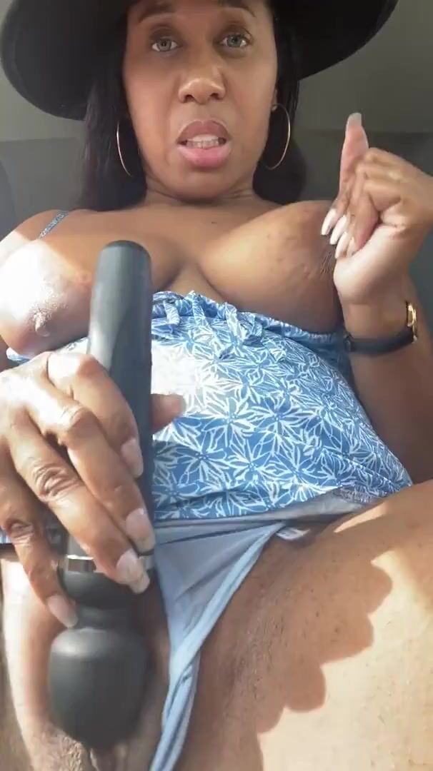Milf plays with pussy in car