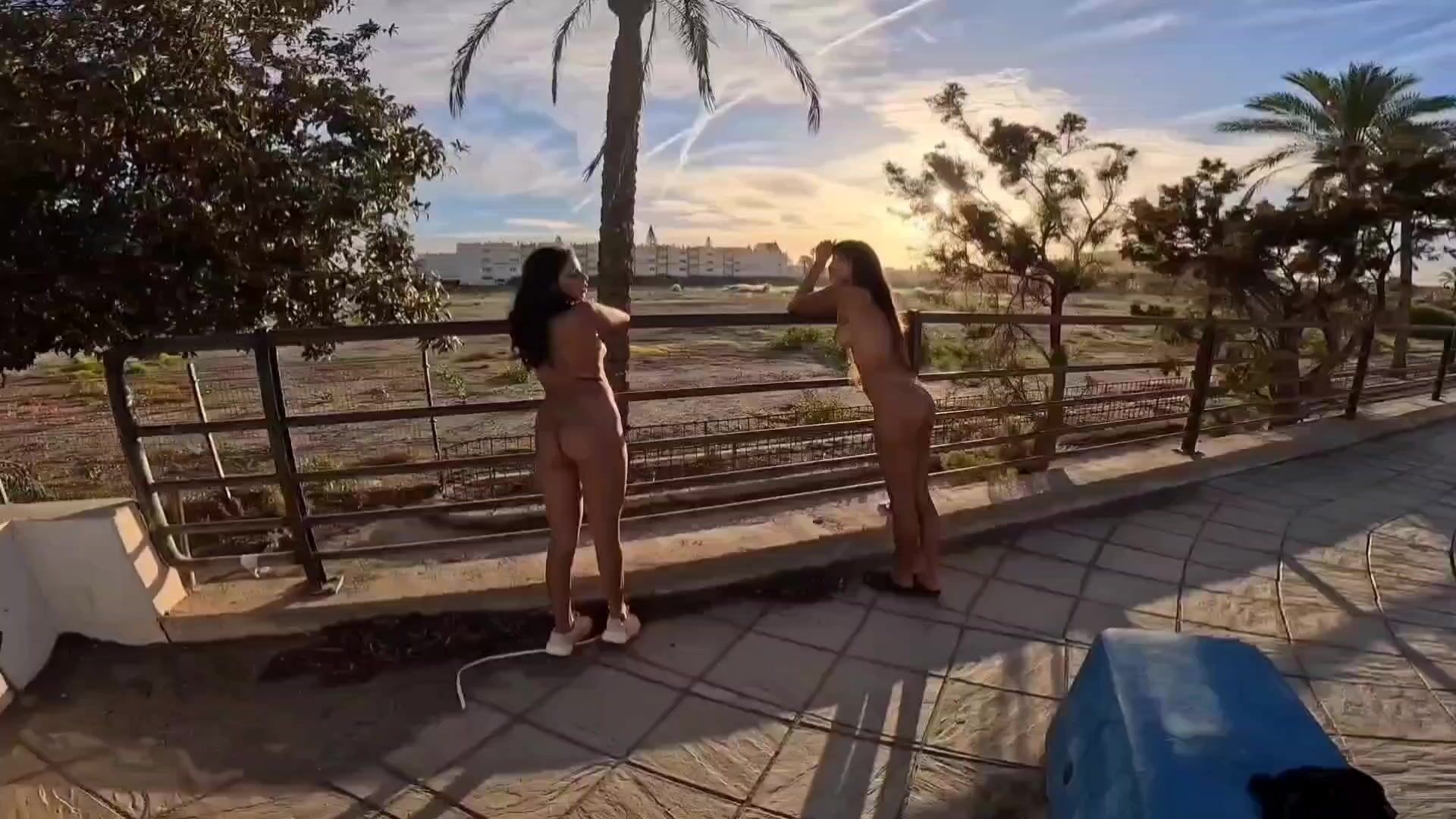 A Japanese and a Latina naked in public