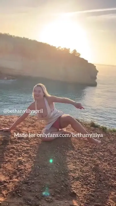 Bethanylilya - bethanylilya silk dress on the cliff in portugal at sunrise